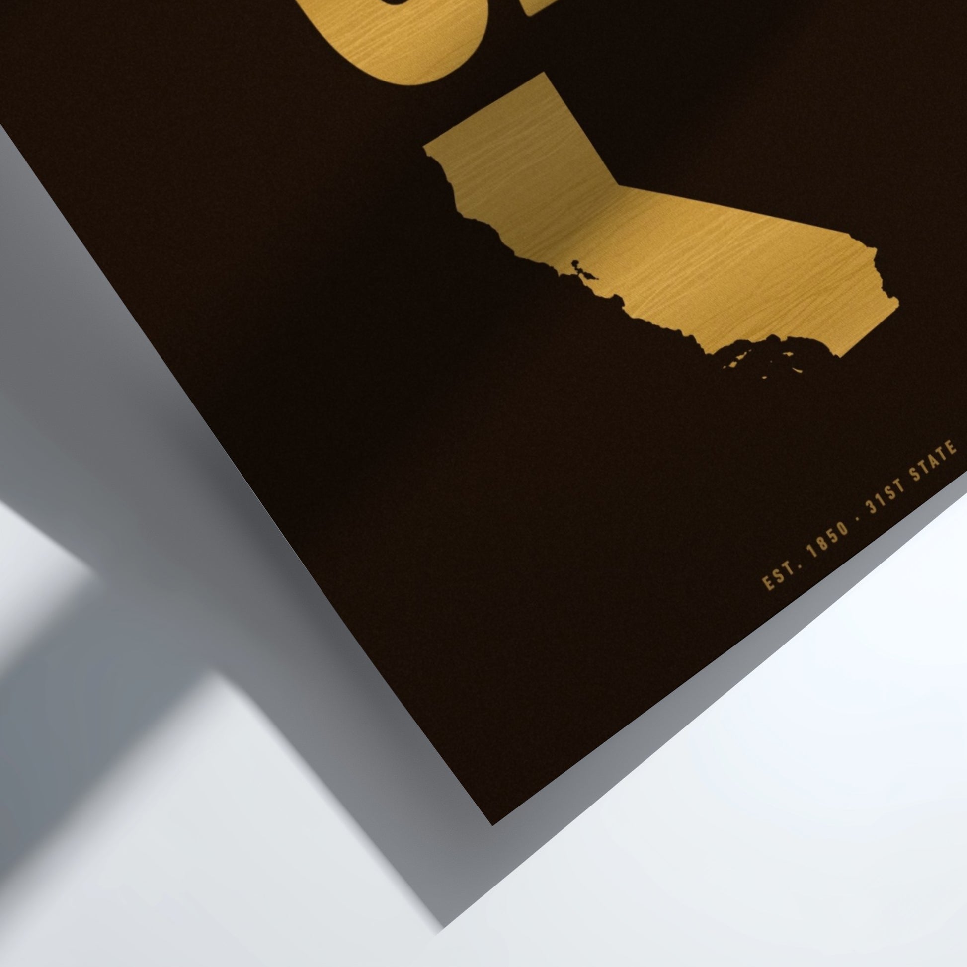 Gold map of California on a black background