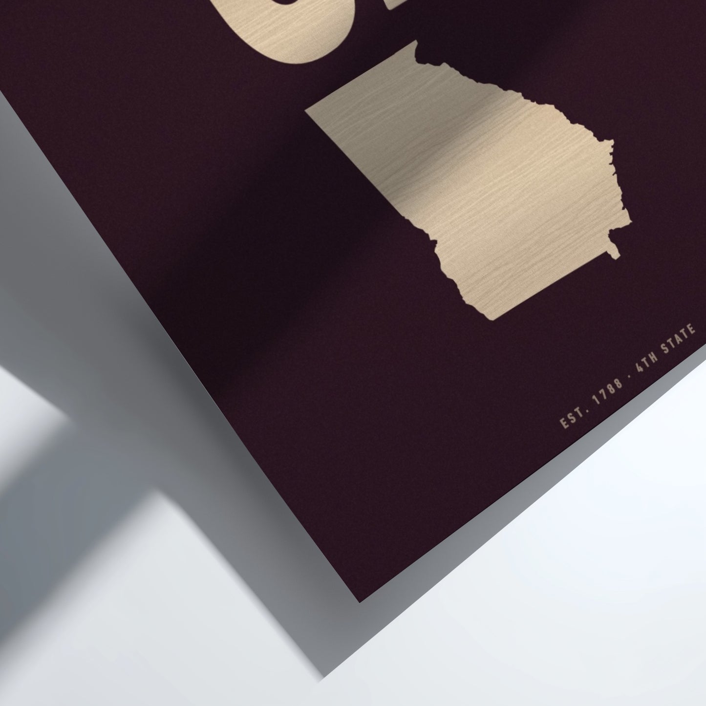 Map of Georgia with gold outline on a dark background