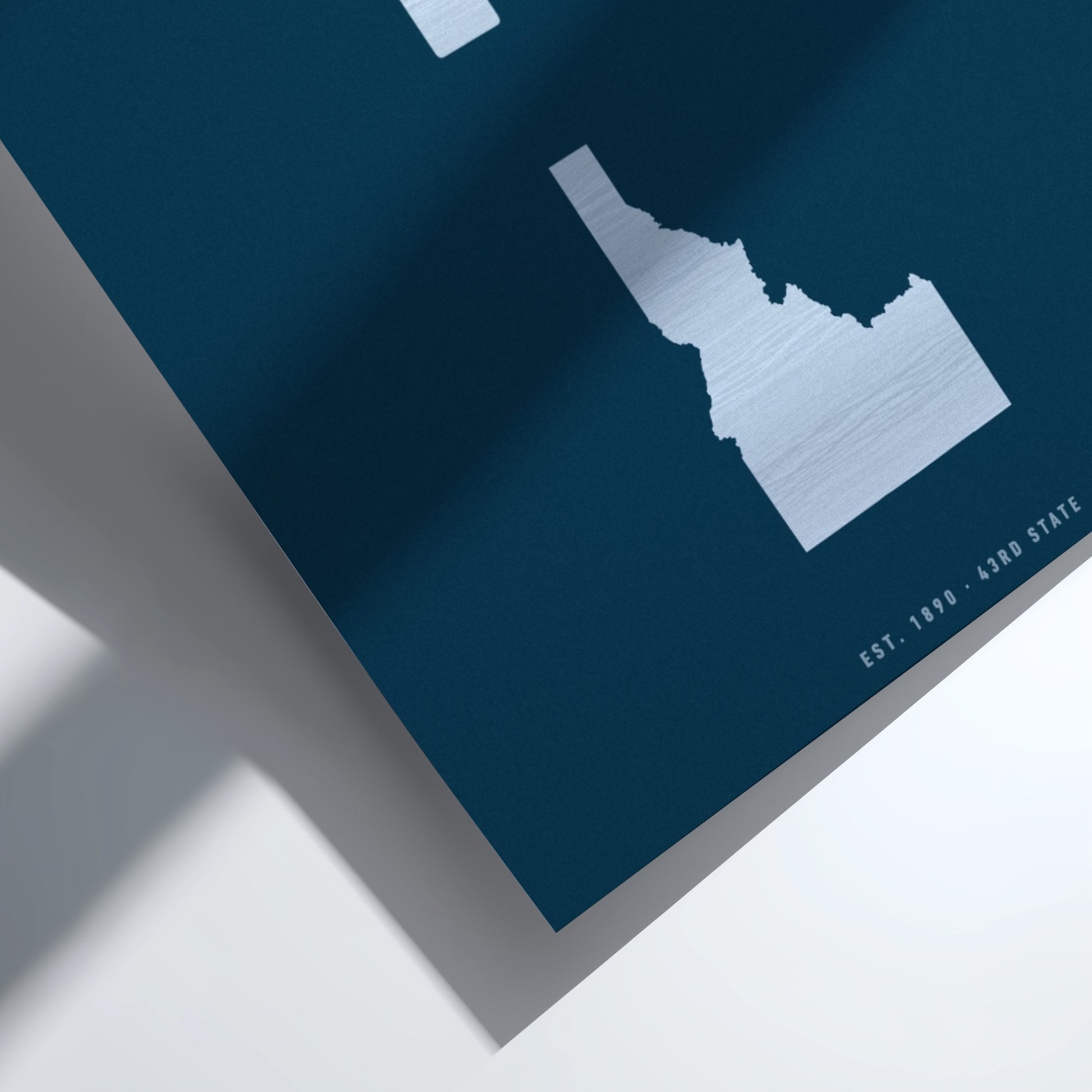 Map of Idaho on a blue background with a white border