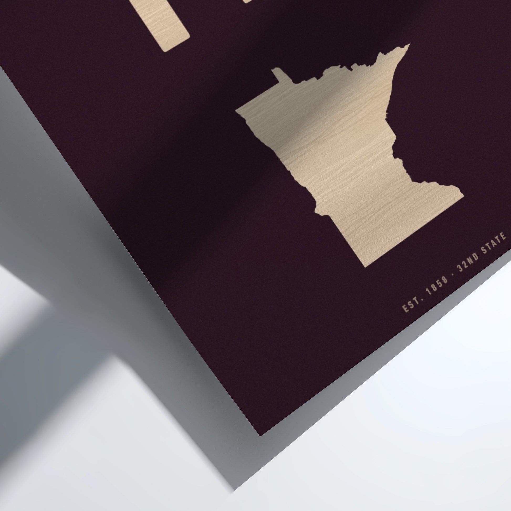 Gold state outline on a dark purple background