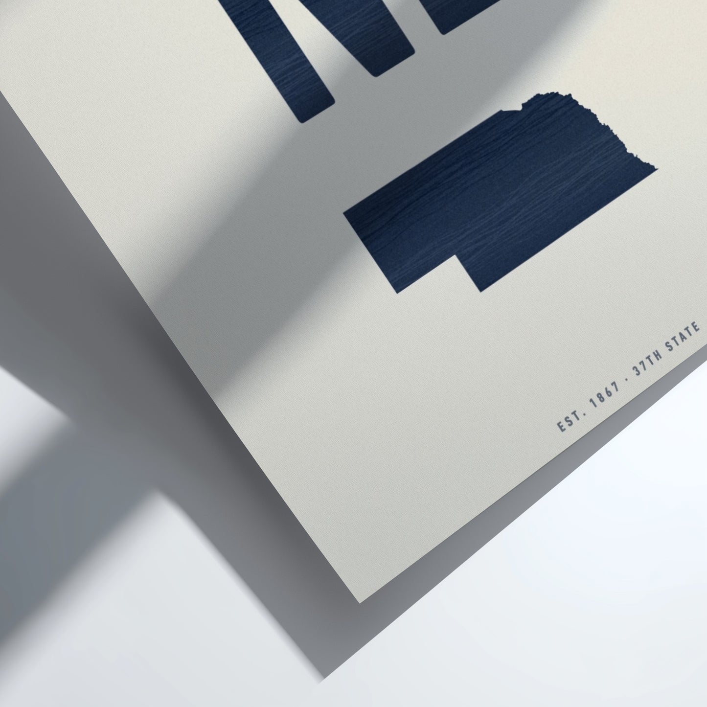 Navy blue abstract shapes on a light gray background