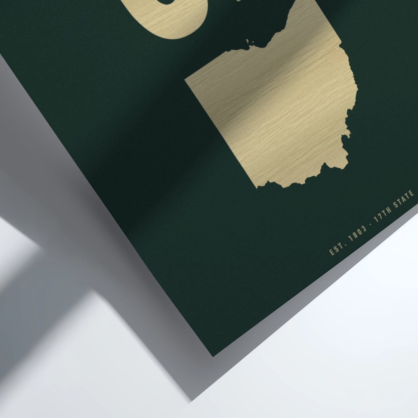 Map of Ohio with gold outline on a dark green background