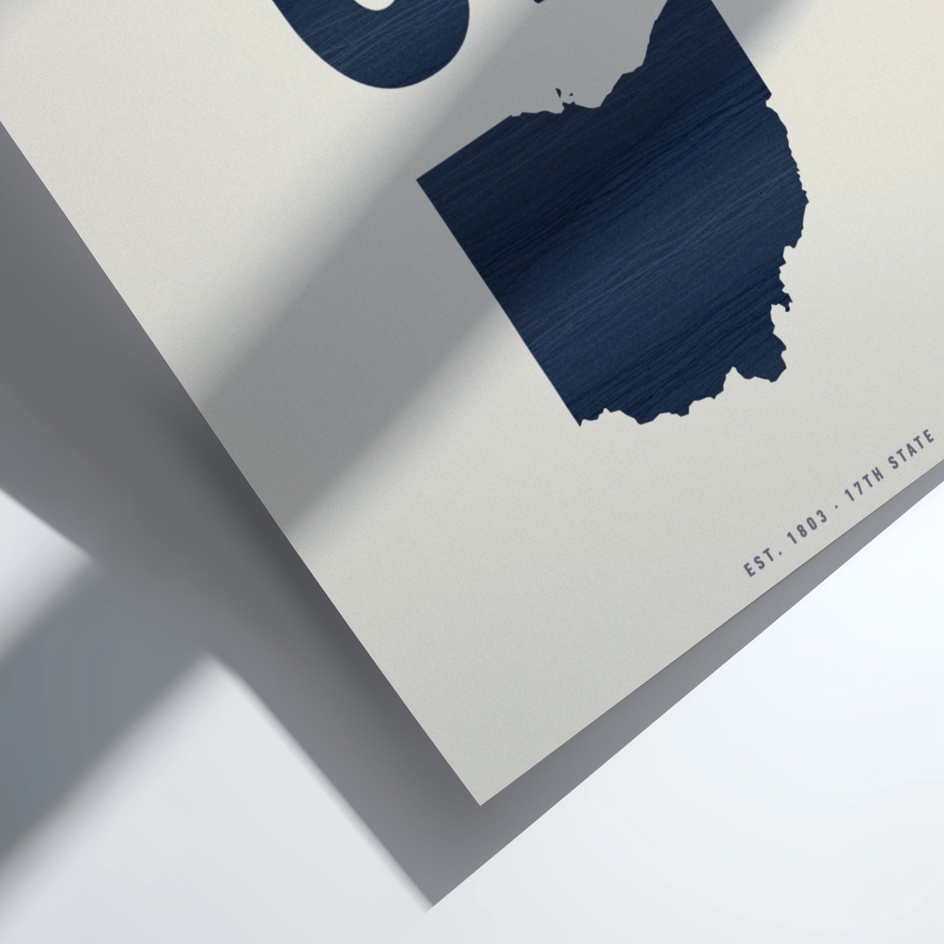 Navy blue state-shaped cutout on a light gray background