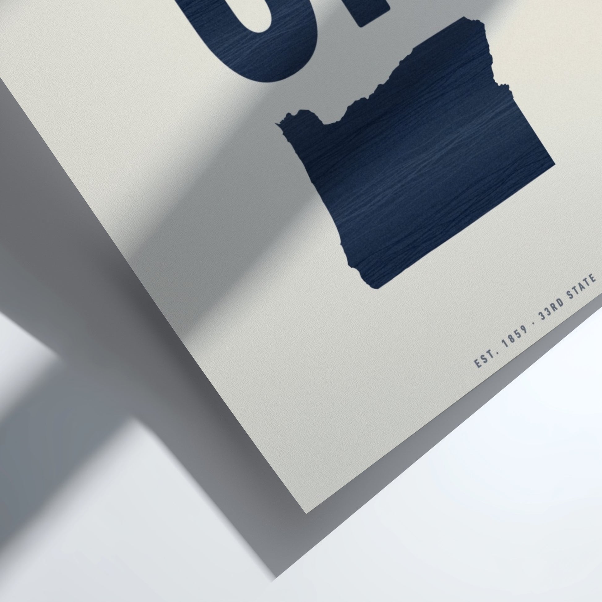 Navy blue paint swatch on a textured white surface