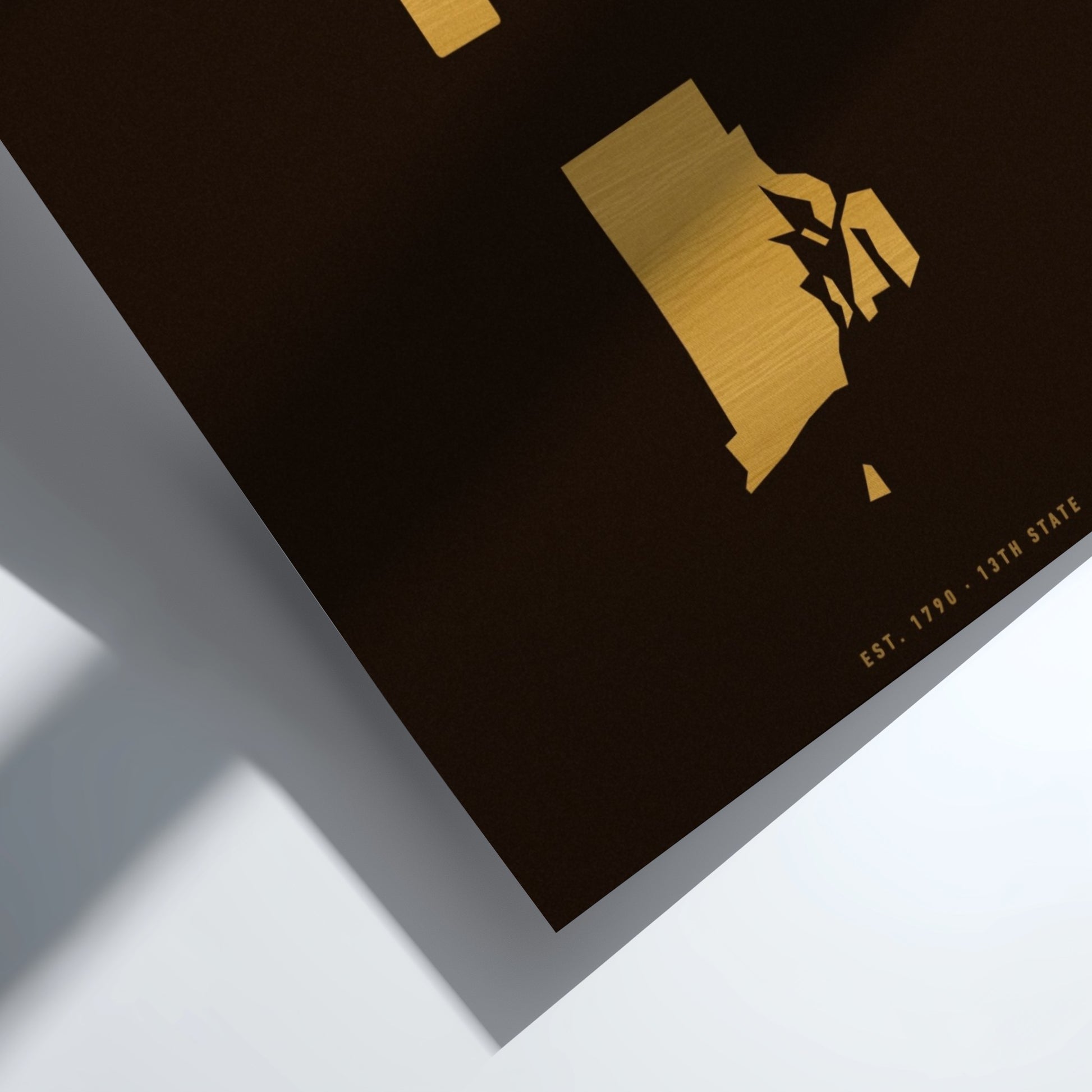Black surface with gold geometric design and '13th State' text on a white background