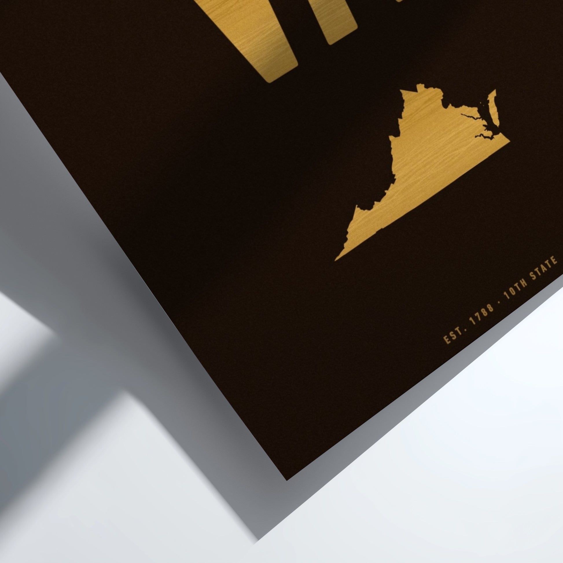 Gold map of Virginia on a black background