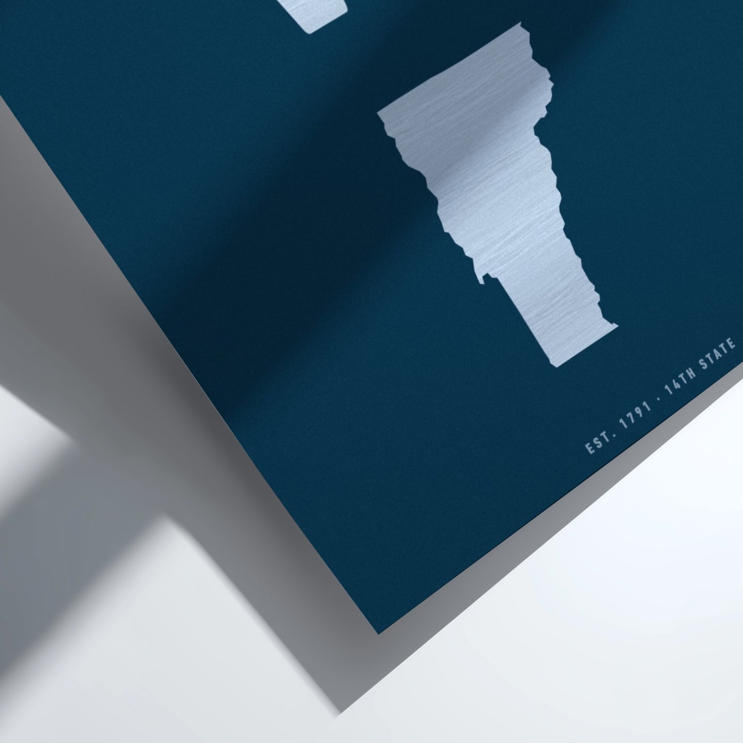 Map of Vermont on a blue background with a white border