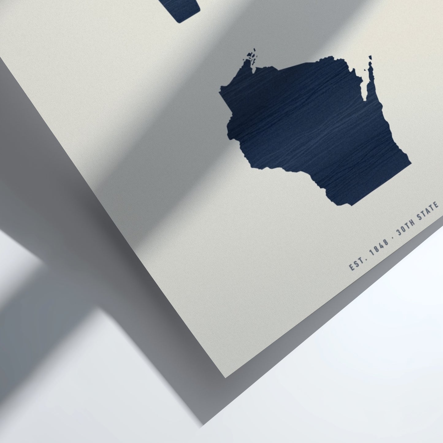 Navy blue map of Wisconsin on a light gray background