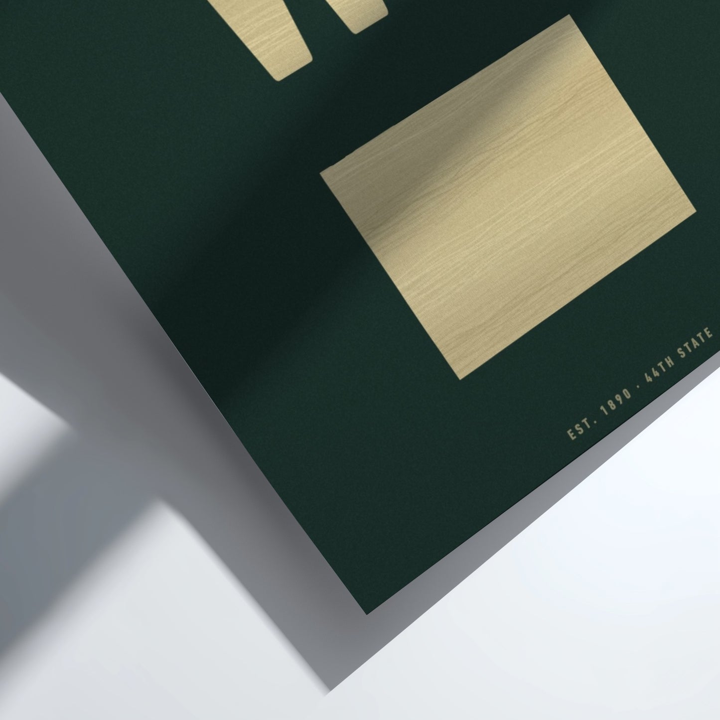 Green box with gold lid on a white background
