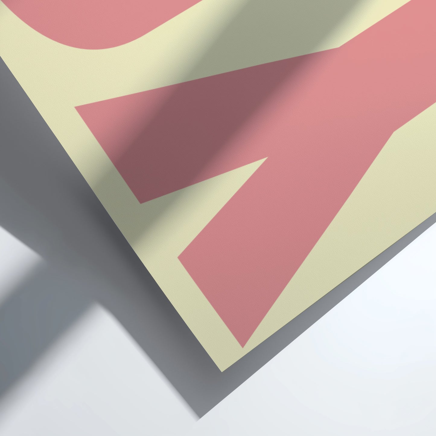 Close-up of a geometric pattern with pink and beige shapes on a white background