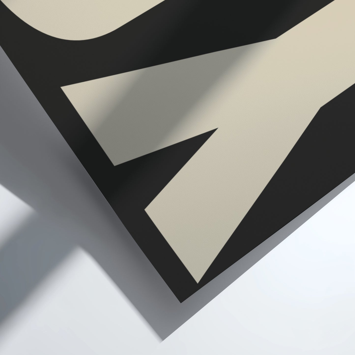 Abstract design with black and beige shapes on a light gray background