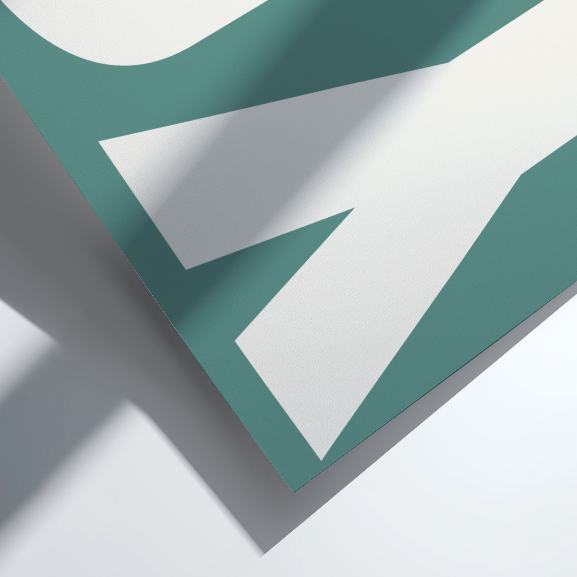 Teal and white geometric shapes on a light gray background