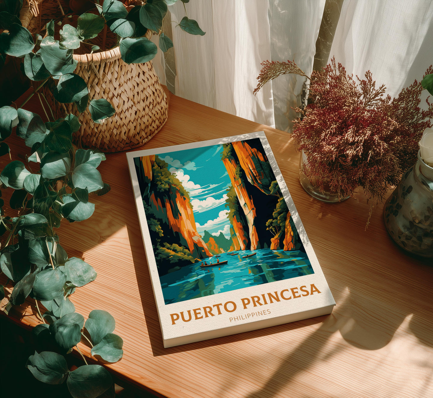 Canvas 'Puerto Princesa Philippines' on a wooden surface with plants around
