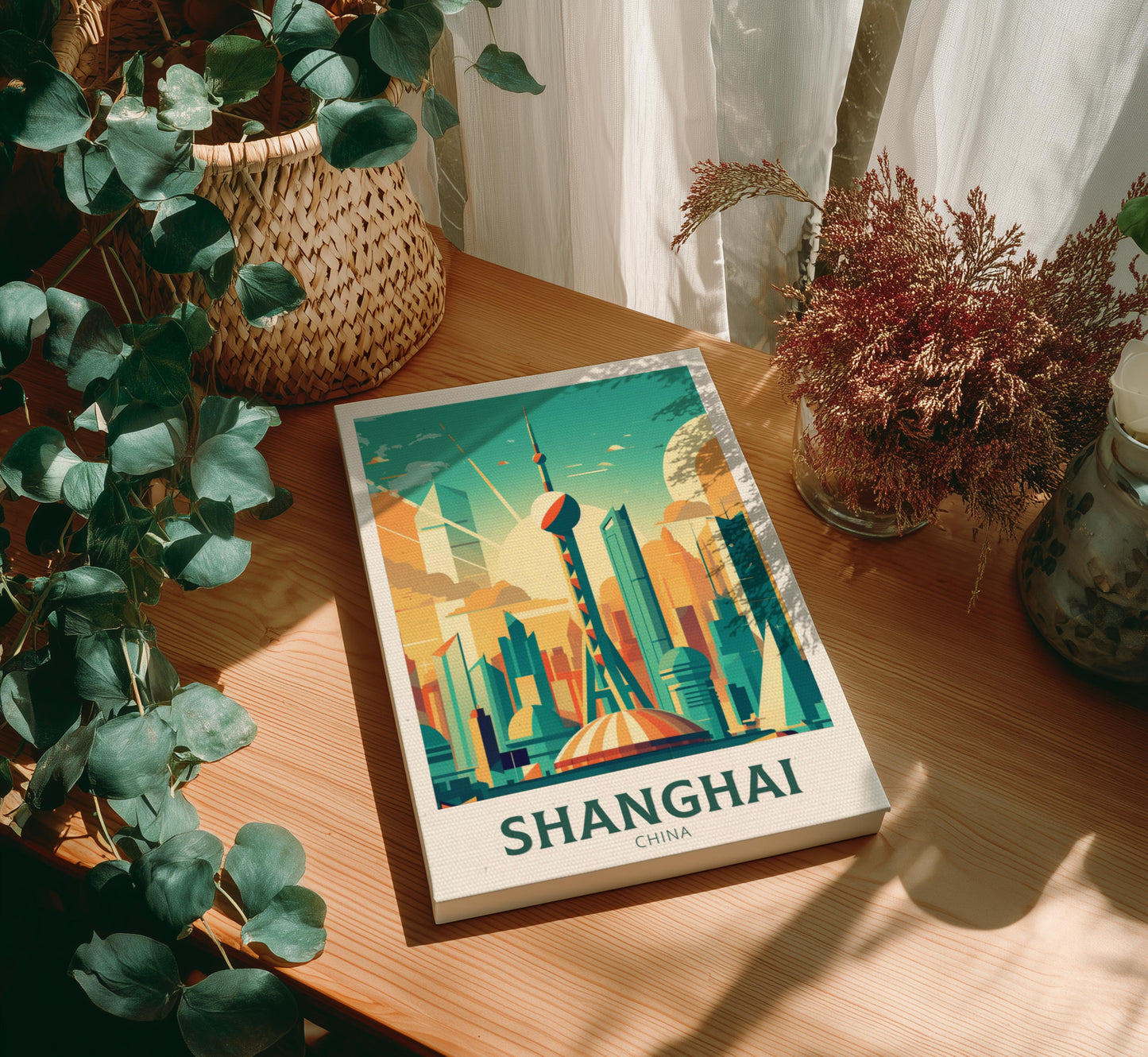 Canvas with a Shanghai cityscape illustration on a wooden table with plants
