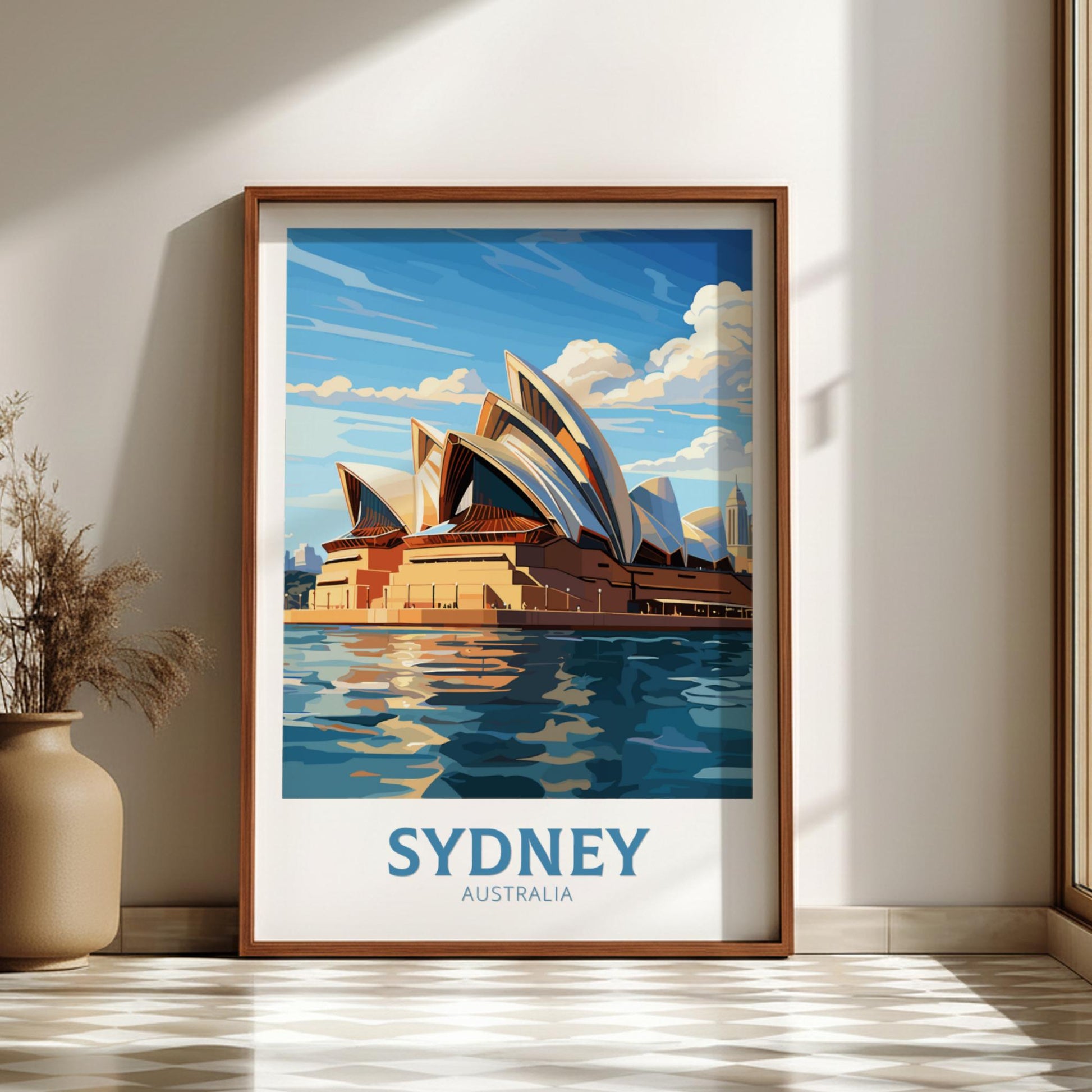 Framed artwork of the Sydney Opera House on a wall with a vase and plant.